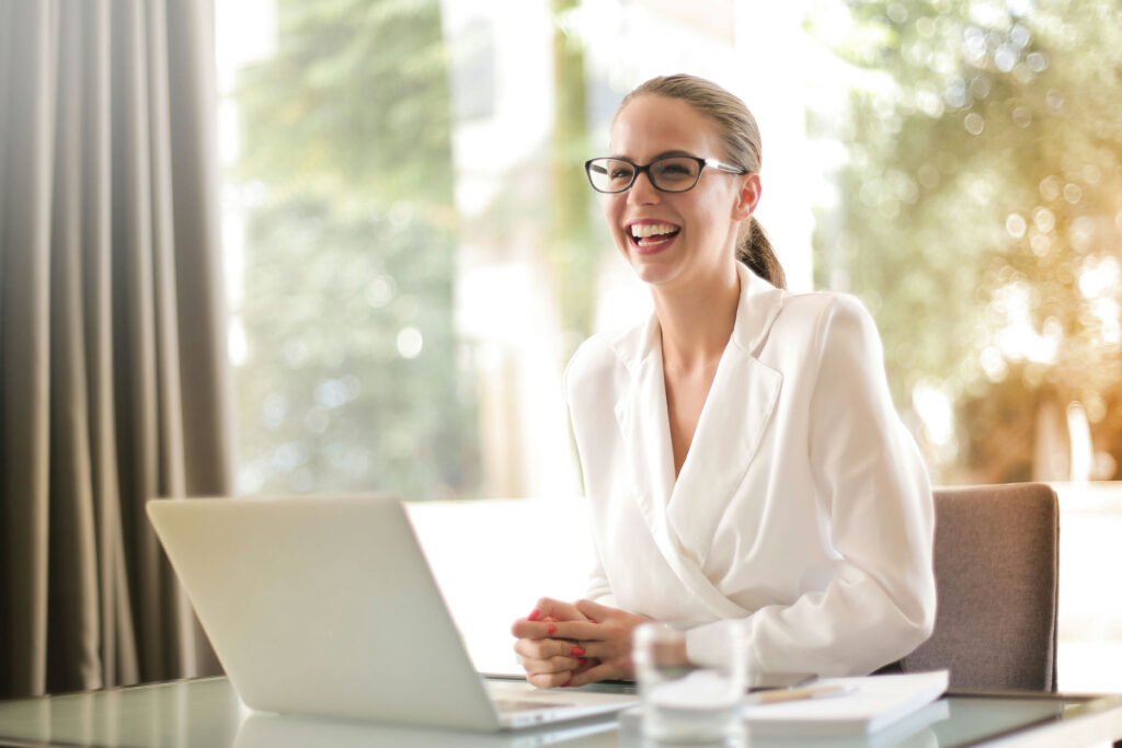 A high-level and confident expert smiles while conducting investment due diligence with a client.