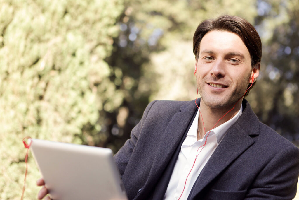 A professional private equity advisor smiles while engaging with their client.