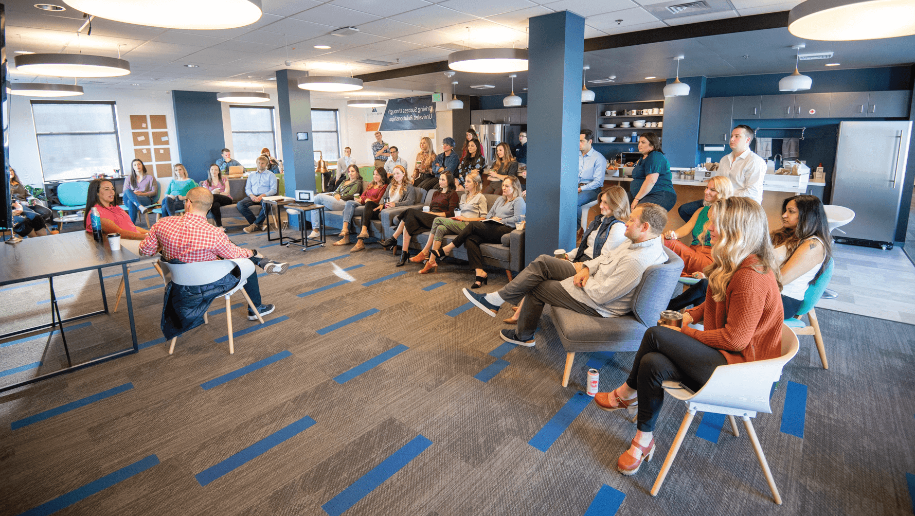 Team members at Apex Leaders in a meeting, showcasing a collaborative and tenacious environment for those seeking private equity careers.