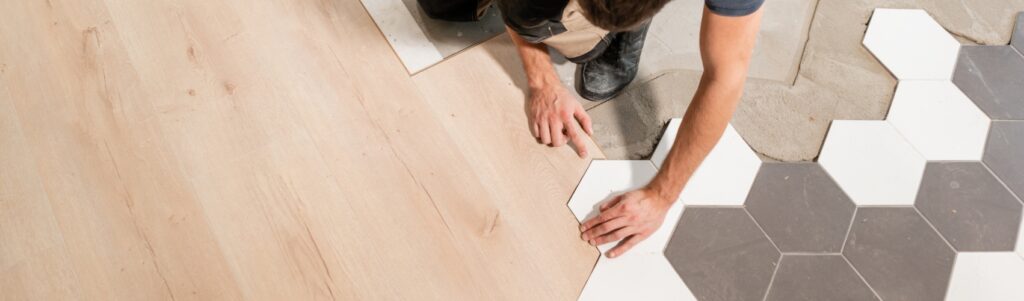Man installing flooring