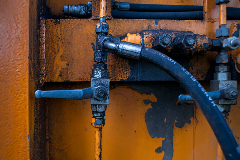 A close-up of a hydraulic pump lever from the pumps industry.