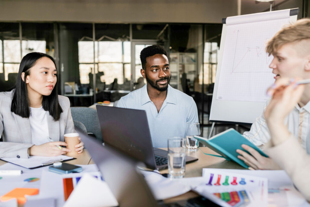 Members of an expert network firm collaborate with one another in an office space.
