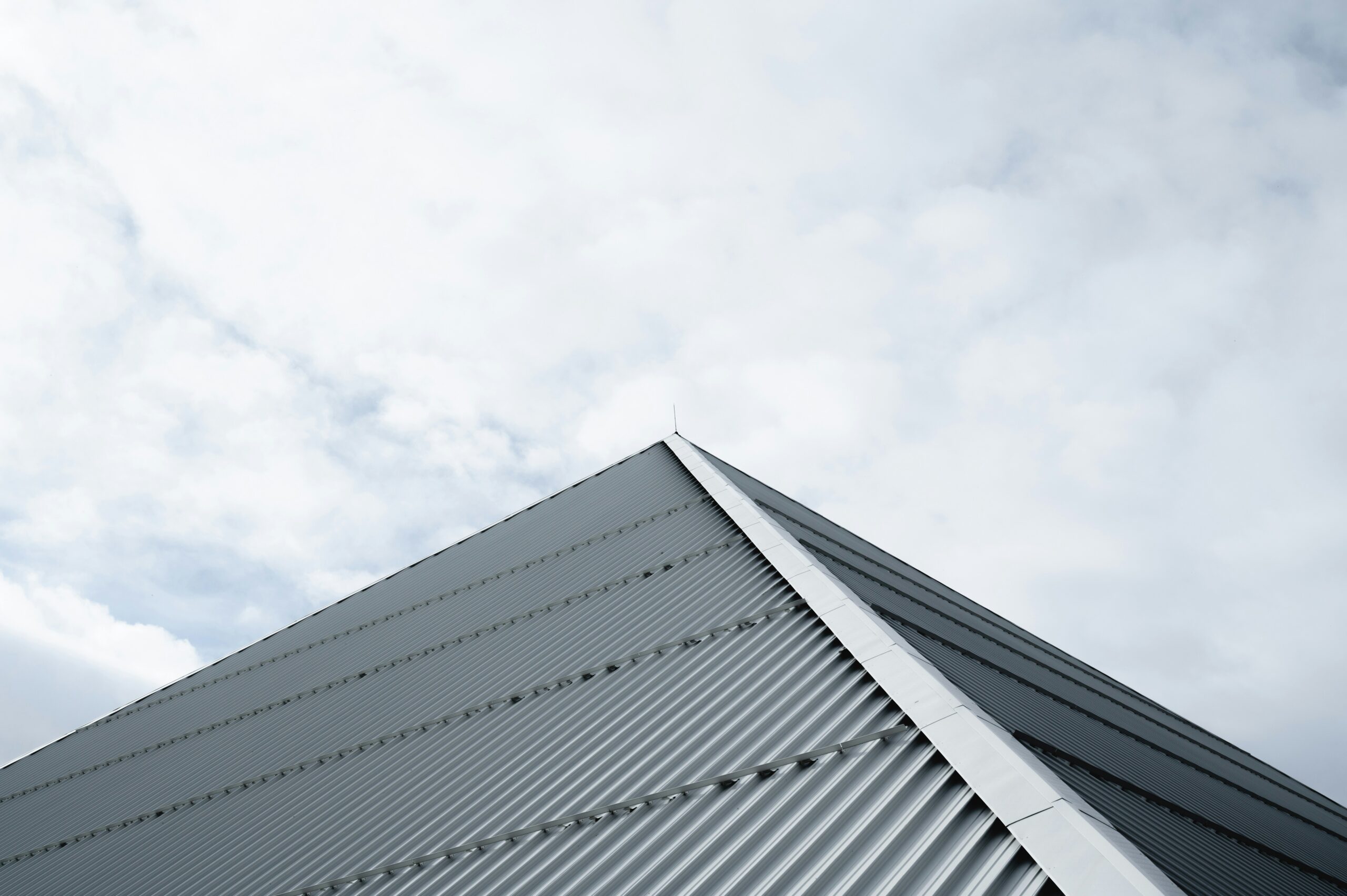 Commercial roof symbolizing private equity due diligence and acquisition in the industry.