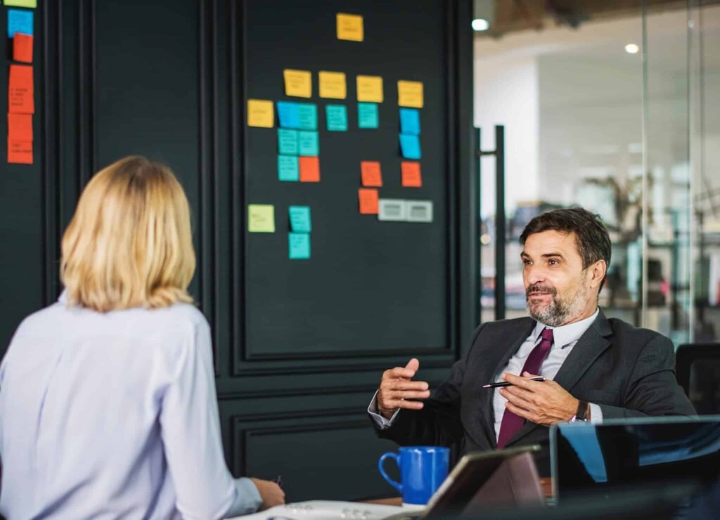 Private equity executives discussing deal post private equity advisory firm call