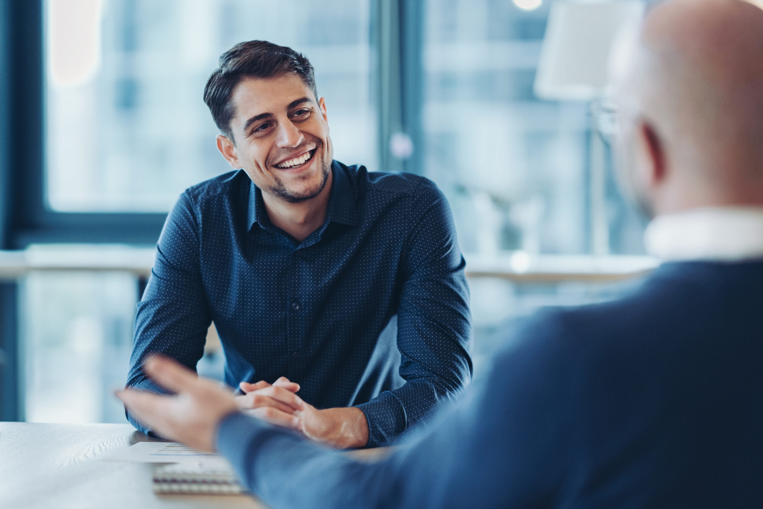 Two businessmen talking in the office